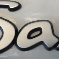 saxo-badge Citroen Saxo Plastic - push in - NEW